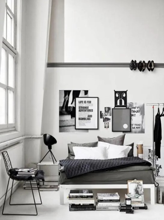 a Scandinavian bedroom with industrial touches   a metal shoes holder on the wall, a makeshift closet and some blackened metal touches