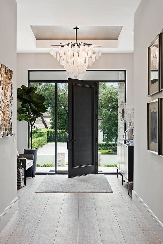 An entryway with a black front door