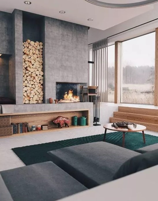 a lovely concrete built in fireplace for a contemporary room