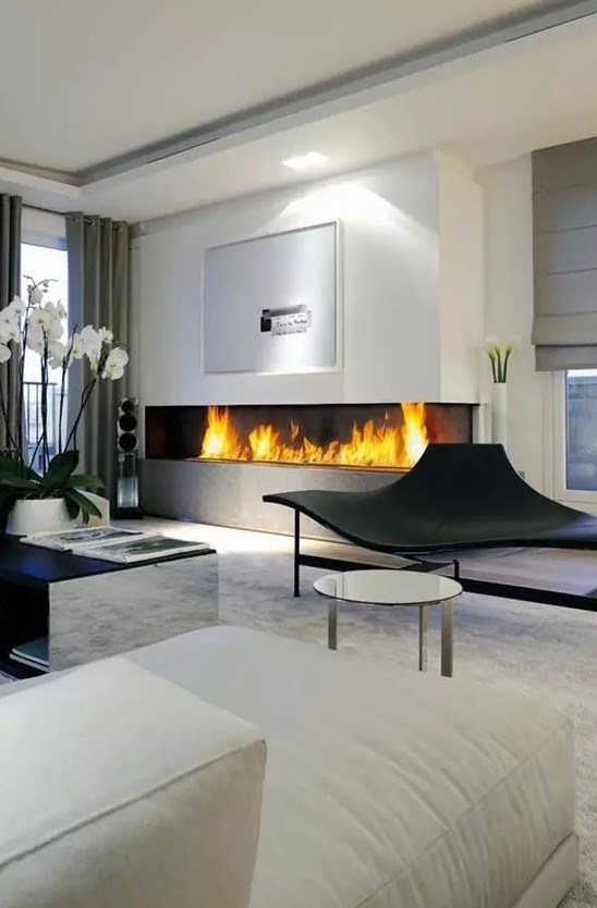 a large minimalist built in fireplace in the living room is a stylish and bold idea with a modern feel