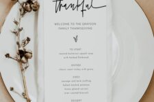 a minimalist Thanksgiving menu on a white plate and with cotton is a stylish idea for a minimalist celebration