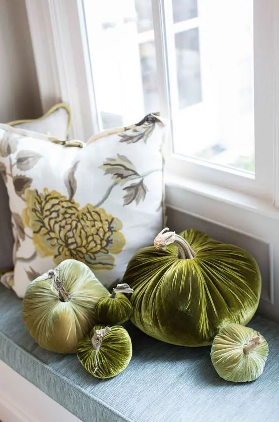 an arrangement of rich green velvet pumpkins is a chic idea for fall and Thanksgiving decor and it will last long