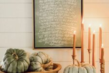 large green heirloom pumpkins and an artwork in green and with white calligraphy are great for fall and Thanksgiving decor