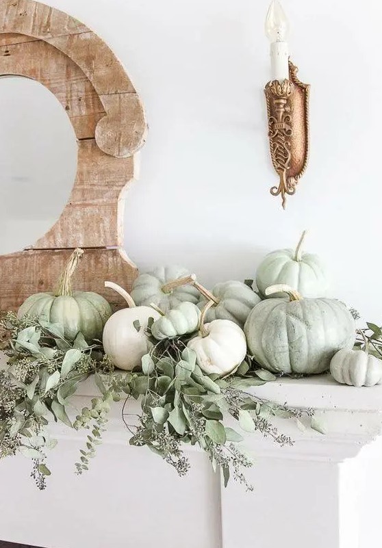 simple rustic mantel styling with white and green heirloom pumpkins and fresh eucalyptus for Thanksgiving