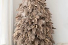03 a boho pampas grass Christmas tree decorated with feathers and dried grasses is a lovely idea for a boho feel in the space