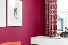 03 a magenta home office, a white desk, a black chair, an orange one, a printed rug and crutains for a bold look