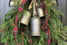 06 a classic Christmas swag of evergreens, vintage bells, red and green plaid ribbon and berries is a cool and bold idea
