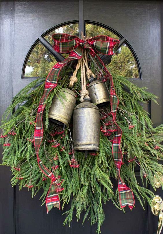 a classic Christmas swag of evergreens, vintage bells, red and green plaid ribbon and berries is a cool and bold idea