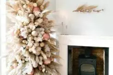 06 a creamy color pampas grass tree decorated with rose gold, gold and white ornaments plus blooms looks heavenly beautiful