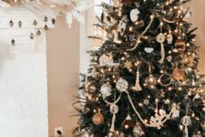 07 a stylish boho Christmas tree with lights, tassels, boho ornaments, chalkboard ones and some deer