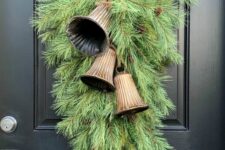 08 a super lush green Christmas posie with large vintage bells and pinecones is a lovely vintage decor idea for the front door
