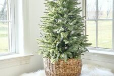 11 a non-decorated tabletop Christmas tree in a basket is a perfect minimalist decor idea to try