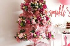 13 a beautiful and super glam pink Christmas tree with pink, fuchsia, gold ornaments, leaves and a lovely gold star tree topper