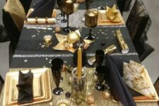 13 a fun black and gold tablescape with stars, stripes and candles is amazing for a New Year’s Eve
