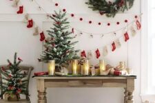 13 a pompom, paper house and decorative stocking garland plus a wreath on the wall can be a nice idea for a vintage space