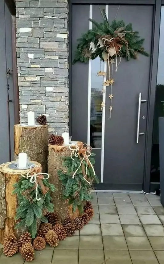 tree stumps with pinecones, fir hangings, candles and a pinecones hanging with stars, ribbons and bows for a rustic feel