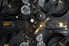 16 a lovely NYE tablescape with black plates and chargers, black linens and gold touches for ultimate elegance