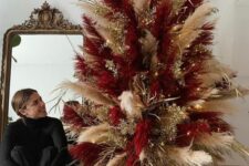 16 a super bold neutral and burgundy pampas grass Christmas tree decorated with gilded branches and lights is cool for the holidays