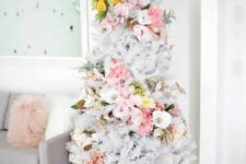 17 a delicate white Christmas tree with pink, white and yellow florals covering it in a swirl, with pale greenery is an out of the box idea