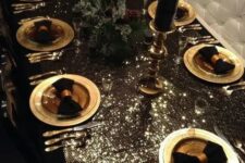 a gorgeous black and gold tablescape