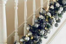 17 a super lush black and silver ornament garland with plenty of lights is a lovely decoration for Christmas