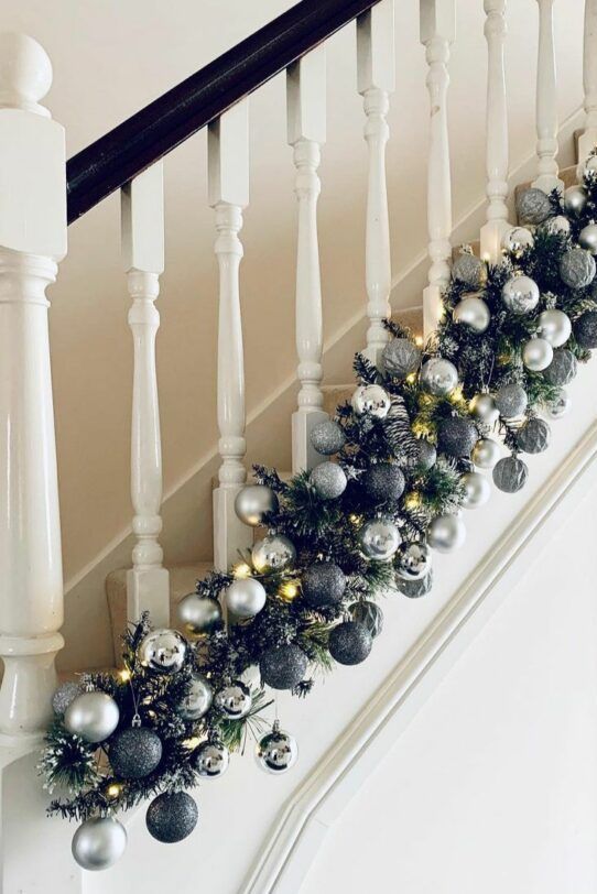 a super lush black and silver ornament garland with plenty of lights is a lovely decoration for Christmas