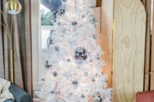 17 a white Christmas tree decorated with silver disco balls is a lovely decor idea not only for Christmas but also for NYE