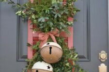 18 a red Christmas sign with greenery and oversized Christmas bells and berries is a lovely decor idea for the holidays