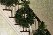 18 a trio of evergreen wreaths with emerald ribbon bows for decorating your banister for Christmas