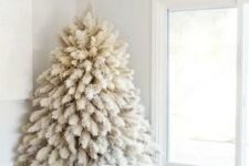 18 a white pampas grass Christmas tree with no decor and only lights is a fntastic solution for a boho feel in the space