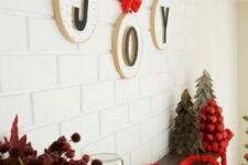 18 hoops with letters and red bows and ribbons are an amazing wall decoration for Christmas