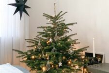 19 a minimalist and Scandinavian Christmas tree with lights, stars and himmeli ornaments is a lovely idea