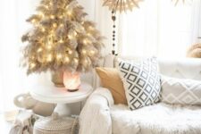 20 a tabletop pampas grass Christmas tree with lights is a cool and chic idea for a boho space, it looks natural and pretty