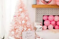 22 a pastel pink Christmas tree decorated with white pompoms, ice cream cones, snowflakes is a dreamy and pretty idea for a glam space