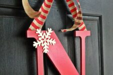 22 a simple red monogram door hanger with striped ribbon and a couple of snowflakes is a great idea for winter