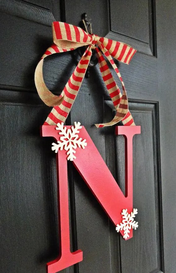 a simple red monogram door hanger with striped ribbon and a couple of snowflakes is a great idea for winter