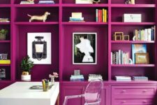 23 a jaw-dropping home office with a magenta storage unit that creates an ambience, a white desk and a clear chair, a gold chandelier