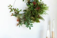 25 a modern and textural holiday wreath with lots of various greenery and foliage, air plants and berries is an amazing idea for winter