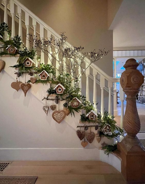 an evergreen Christmas garland with gingerbread houses and hearts plus lights creates a magical atmosphere here