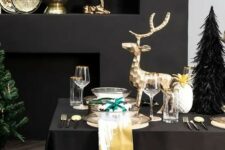 25 luxurious Christmas styling with gold bowls and dishes, gold deer and gold rimmed glasses and chargers is amazing