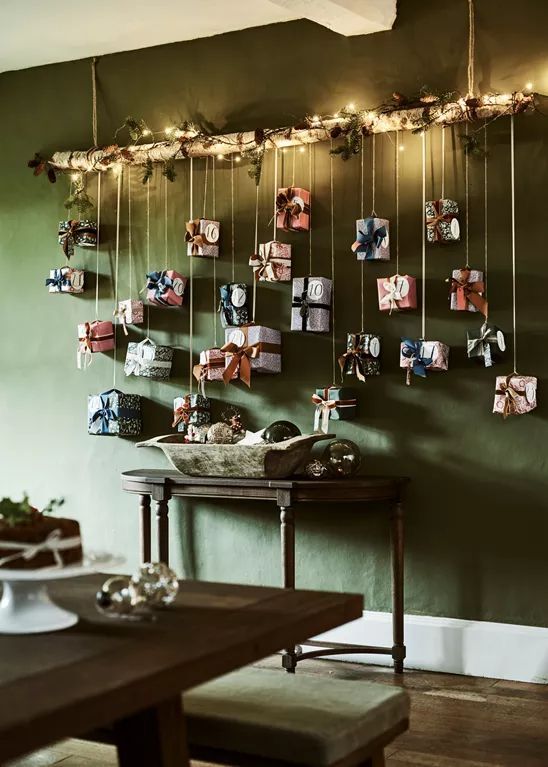 a cool hanging advent calendar with gift boxes is a fantastic Christmas wall decoration that will make everyone happy