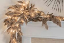 26 a pampas grass and bunny tail Christmas garland with lights is an awesome idea for the holidays