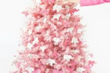28 a blush Christmas tree decorated with pink and white circus animal cookie ornaments is a creative solution with color and unique ornaments