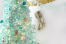 31 a modern mint green Christmas tree with colorful ornaments, a monogram and lights is a lovely and cool idea