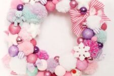38 a pastel Christmas wreath of pompoms and ornaments, stars and snowflakes and striped ribbons is a pretty decoration