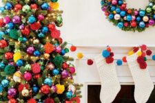 44 a Christmas tree decorated with super bold ornaments and pompoms plus lights is amazing