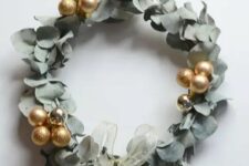 46 a super modern and bold eucalyptus and gold ornament wreath with a delicate ribbon bow is amazing for Christmas