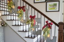 47 metal letters decorated with lights and red bows will be a beautiful solution for your Christmas banister