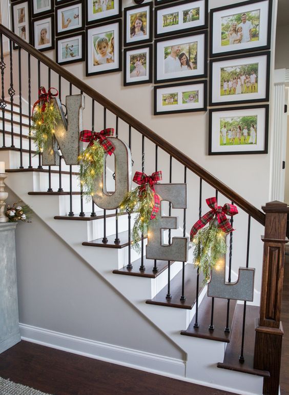metal letters decorated with lights and red bows will be a beautiful solution for your Christmas banister
