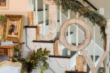 52 shabby wooden JOY letters attached to the banister and a foliage and burlap garland will match a shabby chic or farmhouse space